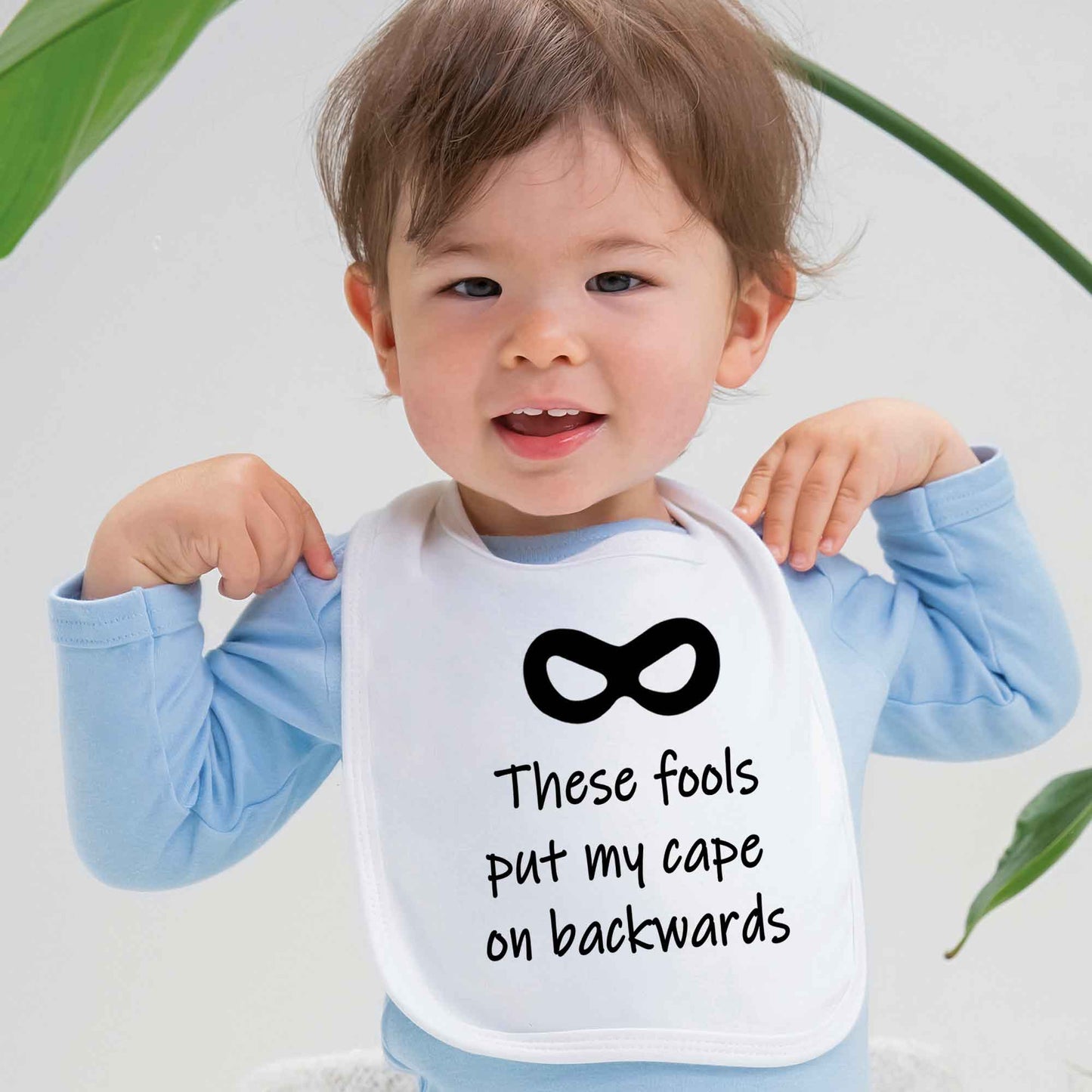 Baby Bib 'These Fools Put My Cape On Backwards' Funny Bib - FLUX DESIGNS